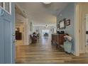 Open entryway boasting beautiful hardwood flooring and a lovely view into the dining room at 3473 Plow Ground Rd, Johns Island, SC 29455