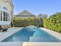 Refreshing backyard pool with surrounding patio, lush landscaping, and privacy at 3608 Maidstone Dr, Mount Pleasant, SC 29466