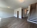 Open floor plan with modern flooring and stairs leading up to the second floor at 5126 Double Eagle, Summerville, SC 29485