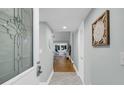 Inviting entryway with decorative glass door and views into the home's living spaces at 626 Double Eagle Trce, Johns Island, SC 29455