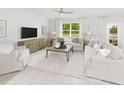 Bright living room with a large window, neutral furniture, and a stylish entertainment center at 743 Meadowbrook Ln, Summerville, SC 29486