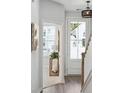 Inviting hallway with natural light, a view to the outside, and light gray paint at 830 Alma Square Dr, Moncks Corner, SC 29461