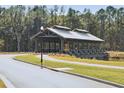 Picturesque covered bridge in a serene community setting with landscaped pathways at 1006 Tulip Shell St, Summerville, SC 29485