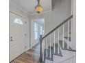 Bright foyer with staircase and view into adjacent rooms at 103 Laurens Ct, Summerville, SC 29485