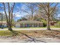 Charming single story house with a well-manicured lawn and blue door at 103 Sprucewood Dr, Summerville, SC 29485
