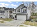 Charming two-story home with gray siding and a covered front porch at 1161 Triple Crown Ct, Mount Pleasant, SC 29429