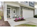 Cozy front porch with seating and decorative plants at 1161 Triple Crown Ct, Mount Pleasant, SC 29429