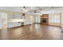 Bright living room showcases wood floors, a brick fireplace, built-in cabinets, and French doors to the outside at 1308 Coleridge St, Charleston, SC 29407