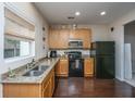 Efficient kitchen featuring modern appliances, granite countertops, and hardwood floors at 138 Hidden Palms Blvd, Summerville, SC 29485