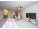 Cozy living room with plush pink sofa, dining area, and ample natural light at 138 Hidden Palms Blvd, Summerville, SC 29485