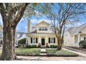 Charming two-story home with a welcoming front porch and well-manicured lawn at 1407 Swamp Fox Ln, James Island, SC 29412