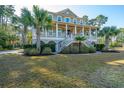 Charming two-story home with double porches and mature trees at 1427 Shell Fish Ct, Mount Pleasant, SC 29466