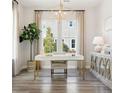 Stylish home office with a modern desk, attractive lighting, and large windows overlooking the landscaped yard at 1437 Clay Field Trl, Summerville, SC 29485