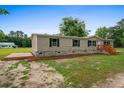 Well-maintained single-story home with a stone foundation and inviting front entrance at 1657 Short Cut Rd, Cross, SC 29436