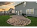Spacious backyard with a curved brick patio perfect for outdoor dining and a well-maintained lawn at 233 Old Carolina Dr, Goose Creek, SC 29445