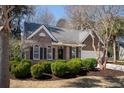 Charming single-story brick home with manicured landscaping and an attached two-car garage at 3425 Oxfordshire Ln, Mount Pleasant, SC 29466