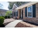 Charming single-story brick home with manicured landscaping and an inviting walkway to the front door at 3425 Oxfordshire Ln, Mount Pleasant, SC 29466