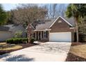 Charming single-story brick home with manicured landscaping and an attached two-car garage at 3425 Oxfordshire Ln, Mount Pleasant, SC 29466