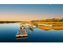 Waterfront property featuring private wooden dock with gazebo on tranquil waterway with marsh views at 4009 Ballovista Rd, Johns Island, SC 29455