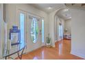 Inviting foyer with hardwood floors, and arched doorway at 4462 Francis Yonge Way, Hollywood, SC 29449
