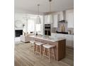 Beautiful kitchen with a large island, white cabinets, and stylish pendant lighting at 707 Alma Square Dr, Moncks Corner, SC 29461