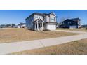 Charming two-story home with gray siding, a two car garage, and a well-manicured lawn at 112 Edisto Crossing Ct, Ridgeville, SC 29472
