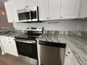 Modern kitchen with stainless steel appliances and stylish countertops at 1411 Telfair Way, Charleston, SC 29412