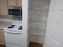 Clean kitchen with stainless steel microwave and pantry space at 1530 Fort Johnson Rd # 3F, Charleston, SC 29412