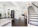 Bright and airy entryway with hardwood floors, staircase, and access to multiple rooms at 1532 Roustabout Way, Charleston, SC 29414