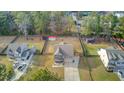 Aerial view of a home with a large, fenced backyard featuring a trampoline and storage shed at 1633 Pimlico Blvd, Moncks Corner, SC 29461