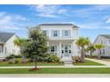 Charming two-story home with manicured lawn, lovely landscaping, and inviting front porch at 1756 Timmons St, Mount Pleasant, SC 29466