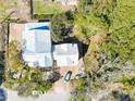 Aerial view showing the roof and the home's position relative to the surrounding trees at 18 Wills Way, Isle of Palms, SC 29451