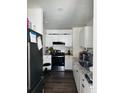Modern kitchen with stainless steel appliances, white cabinetry, and granite countertops at 2326 Kent Ave, North Charleston, SC 29405