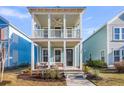 Inviting two-story home with a spacious double porch perfect for relaxing outdoors at 326 Ripple Park Dr, Summerville, SC 29486