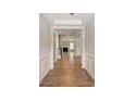 Inviting hallway with decorative trim and hardwood floors at 351 Blue Oak Dr, Moncks Corner, SC 29461