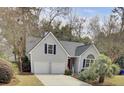 Charming home featuring a two-car garage and well-maintained landscaping at 3518 Gatetree Rd, Johns Island, SC 29455
