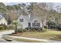 Lovely home with a two-car garage, beautiful front yard, and mature landscaping at 3518 Gatetree Rd, Johns Island, SC 29455