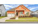 Inviting single-Gathering home with a vibrant exterior, complemented by a manicured lawn and double-door garage at 729 Quintan St, Summerville, SC 29486