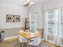 Bright dining room with modern decor and large windows for plenty of natural light at 947 E Estates Blvd # C, Charleston, SC 29414