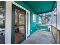 Cozy porch with a comfortable swing and ample space for relaxation at 1009 Seacrest Ln, Folly Beach, SC 29439