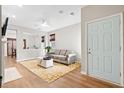 Comfortable living room with a neutral color palette and a view to the dining room at 104 Chemistry Cir, Ladson, SC 29456