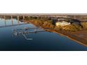 Aerial view of waterfront condo with private boat slip and bridge in the distance at 108 Fairbanks Oak Aly # 302, Daniel Island, SC 29492