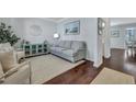 Cozy living room with hardwood floors, a plush sofa, elegant decor, and a serene atmosphere at 109 Loon Dr, Summerville, SC 29483