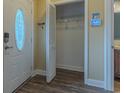 Inviting entryway features wood-look flooring, a coat closet, and a decorative glass front door at 124 Knightsbridge Dr, North Charleston, SC 29418