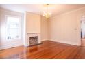 Bright and airy living room with hardwood floors, fireplace and natural light at 157 Tradd St, Charleston, SC 29401