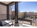 Comfortable seating is available on the home's balcony, providing a nice view of the surrounding neighborhood at 21 George St # 206, Charleston, SC 29401