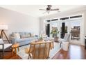 Bright and open living room design featuring hardwood floors, ceiling fan, comfortable seating, and natural light at 21 George St # 206, Charleston, SC 29401