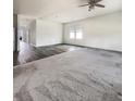 Spacious living room featuring both carpeted and hardwood flooring, large windows, and neutral walls at 307 Sedona Dr, Summerville, SC 29486