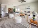 Open living room with hardwood floors, modern decor, and large windows for ample natural light at 307 Sedona Dr, Summerville, SC 29486