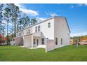 Spacious backyard featuring new lawn, back patio, and a white privacy fence at 5569 Ruby Falls Drive Ln, North Charleston, SC 29420